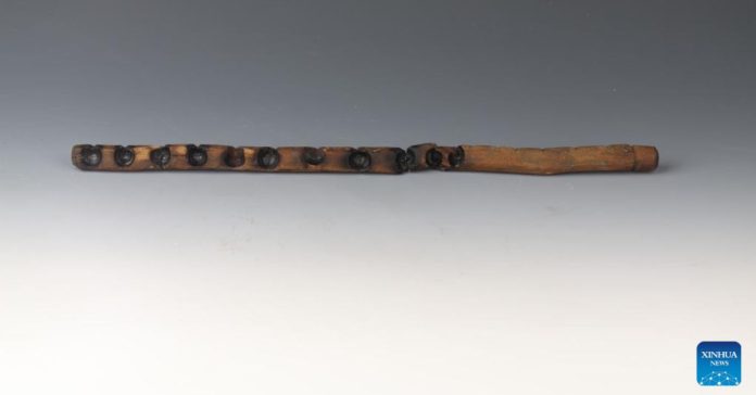 This photo, taken on Jan. 7, 2025, shows the fireboard from a fire-drilling toolset excavated at the Caoyangang archaeological site in Jiangsu Province, east China. (Xinhua)